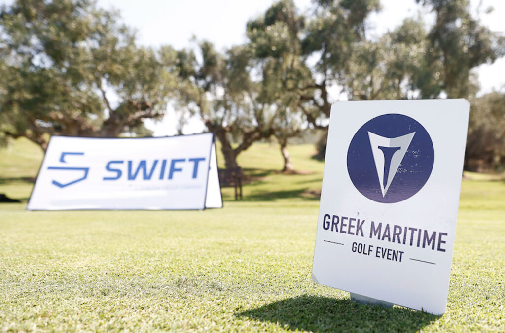 A close up of the Greek Maritime Golf Event sign and the Swift Marine logo sign.