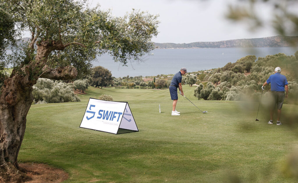 Golfers at Swift Marine Greek golf game tournament.