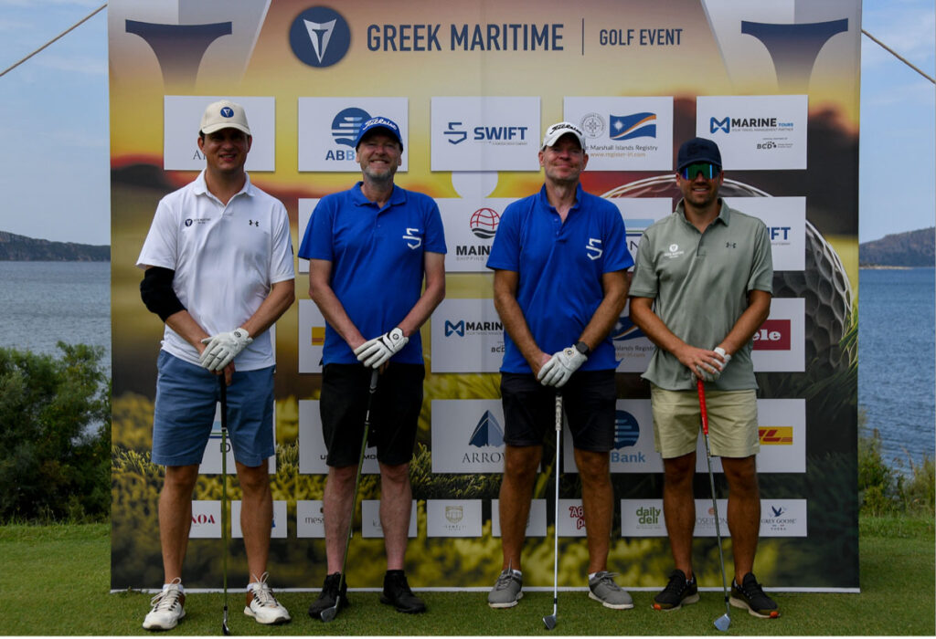 Greek Maritime Golf Event participants standing in front of event signage.