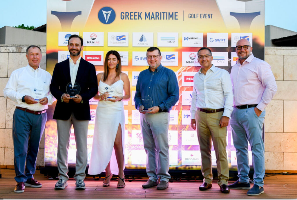 Swift Marine employees holding trophies in front of Greek Maritime Golf Event sign.