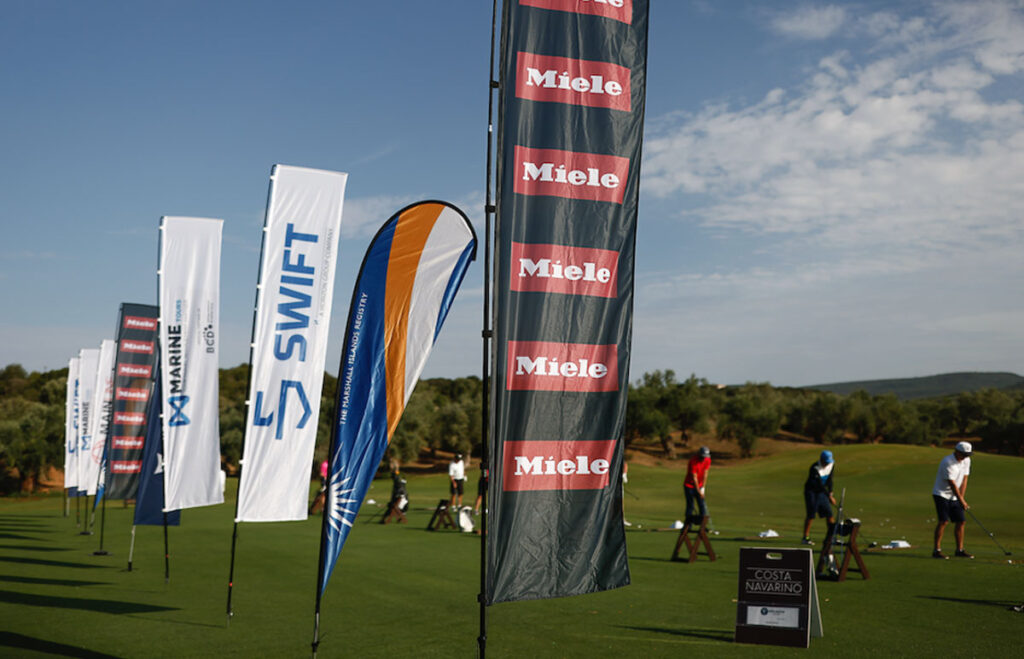 Swift Marine golf event with sponsors on flags.